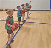 Four children prepare to shoot basketballs.