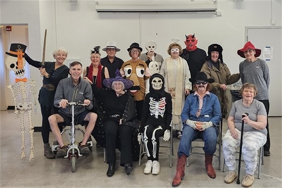 Group of people in Halloween costumes at Curtis Center for the Arts