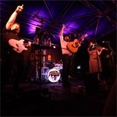 Live band performs on a stage