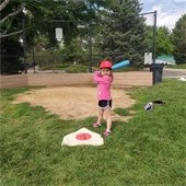 child playing t-ball