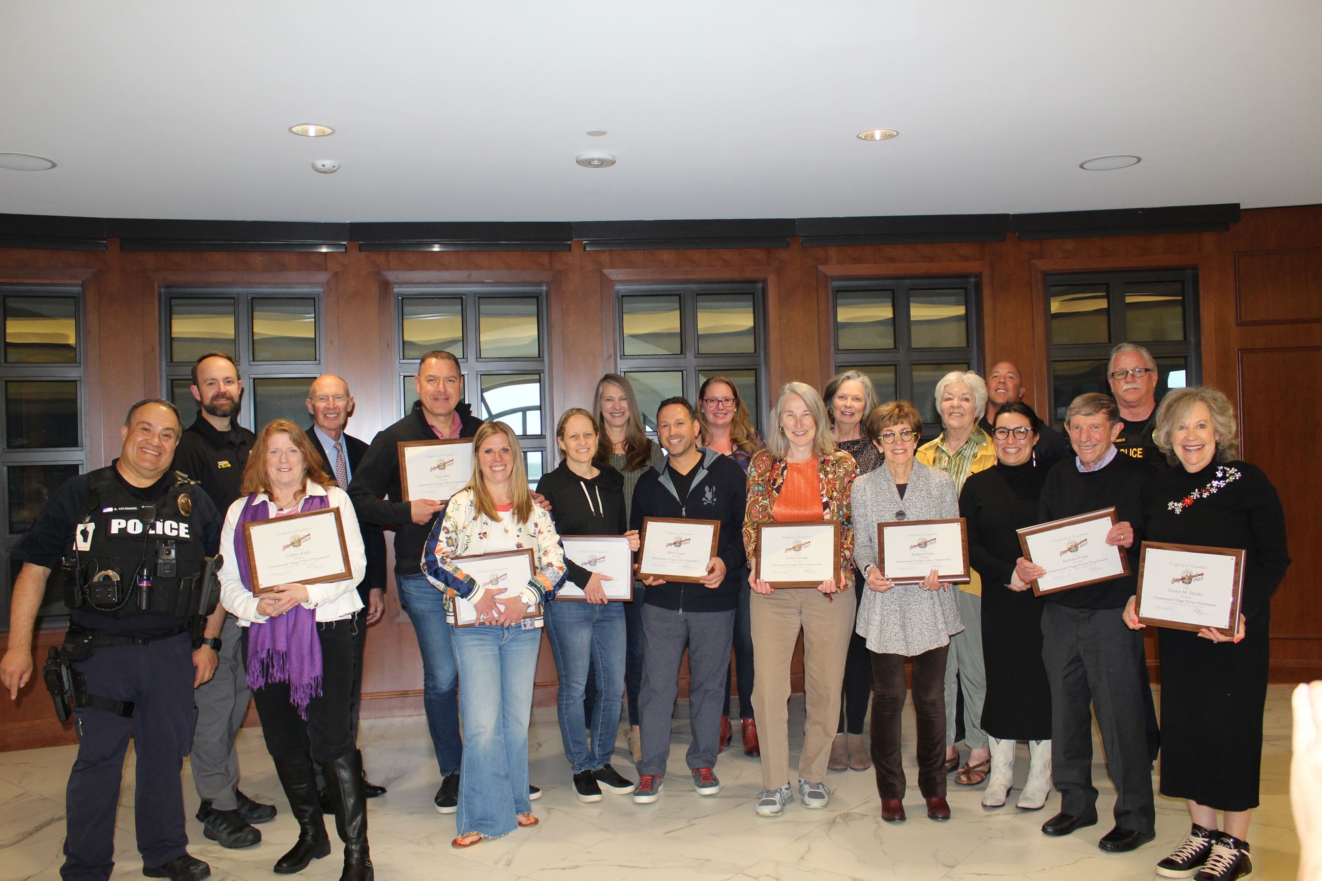 Woman driving a golf cart with Police Officer